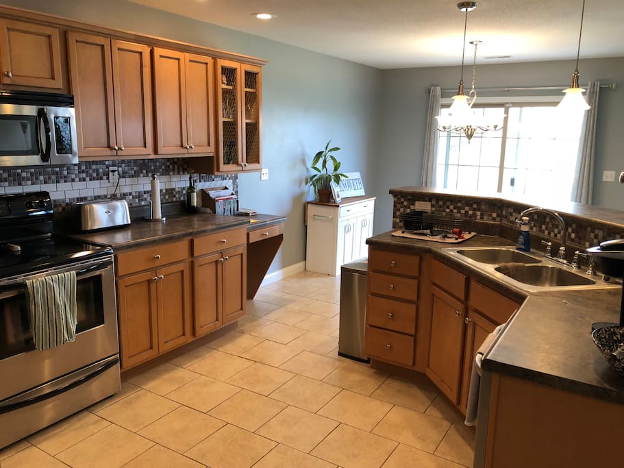Spacious, fully stocked kitchen. Plenty of pots, pans, plates, bowls, utensils, spices and condiments. Oven, stove, microwave, fridge, and dishwasher available for your use!