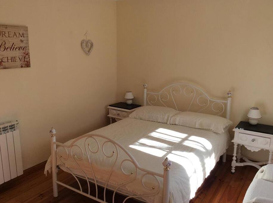 Bedroom one, sunny and bright, clean and comfy, shutters when needed.