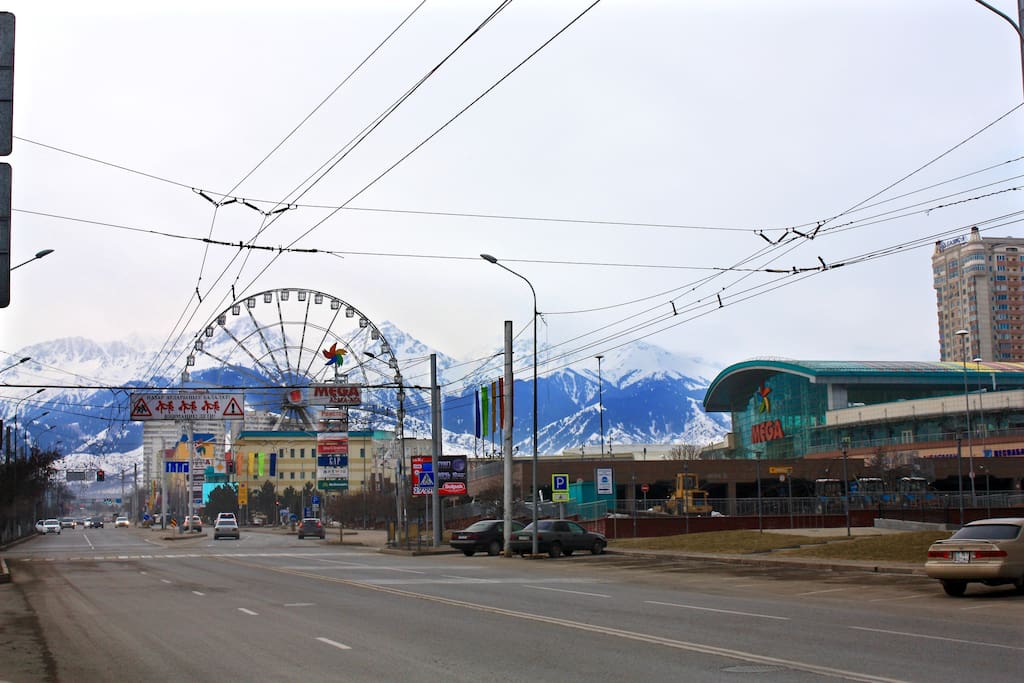 Early in the morning. Across the street located a one of the biggest shopping mall in Almaty - MEGA Alma-ata (boutiques, restaurants, cafes and supermarket) and a panoramic wheel.