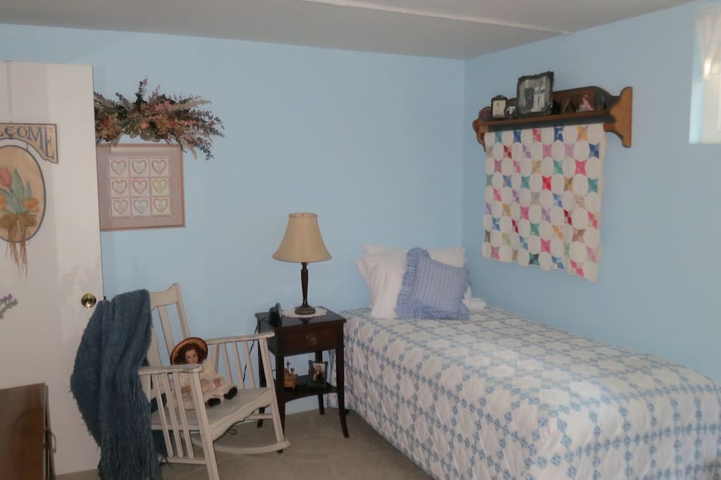 Beds covered with my mom's quilts