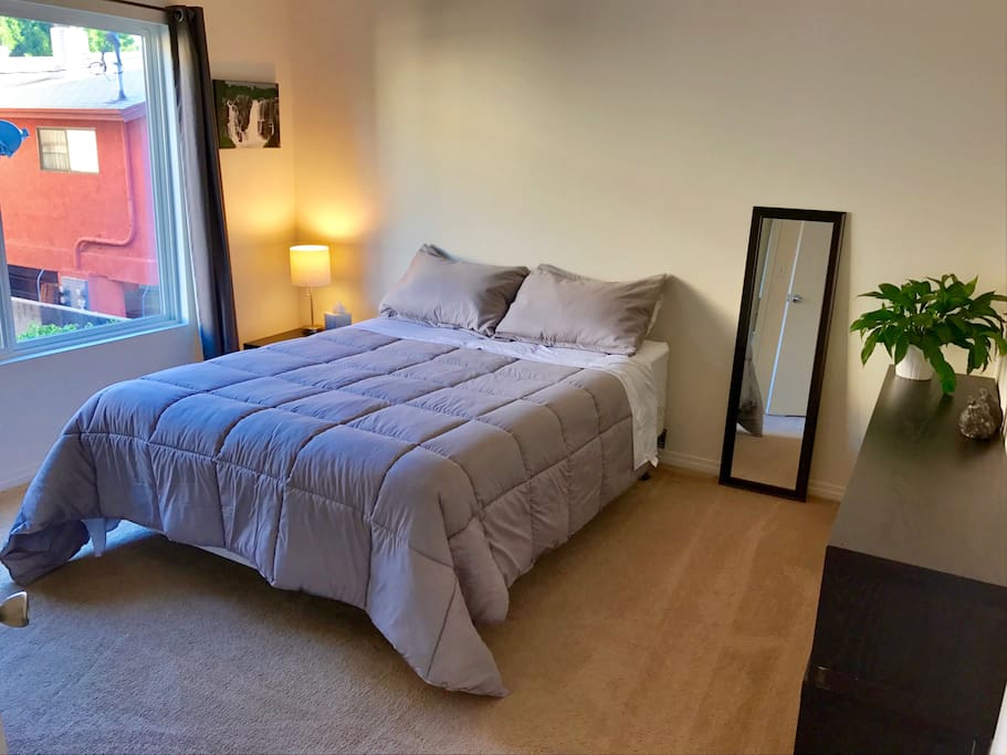 Master bedroom with queen sized bed and plenty of closet space.