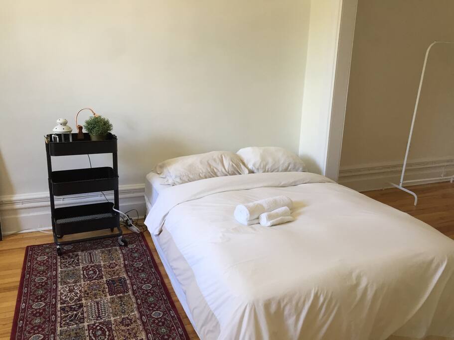 Comfortable bed and night table to relax after a nice day visiting the city.