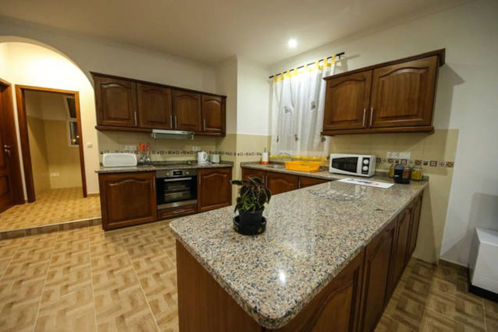 Fully equiped kitchen (oven, stove, microwave, dishes and cutlery and other cooking appliances).