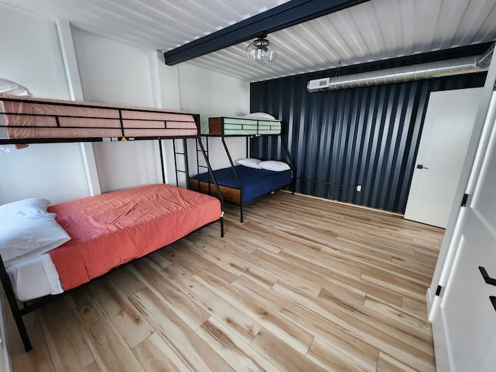 Bedroom #4.  Two bunk beds- twin beds on top, full size on bottom. This room also has a nightlight for kiddos.