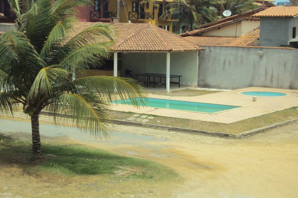 Área de Churrasco e piscina do condomínio