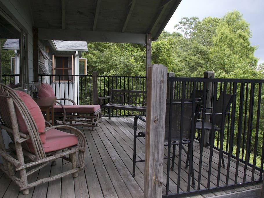 The back porch sits 30 ft off the ground looking over the beautiful mountains