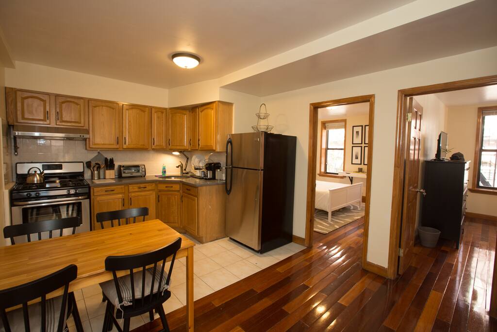 View from Entry Foyer facing Kitchen and Bedrooms 1 & 2.