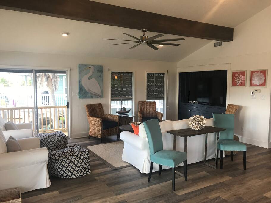 Upstairs open floor plan includes living, dining and kitchen. Living room boasts a big screen smart HDTV with seating up to 10.