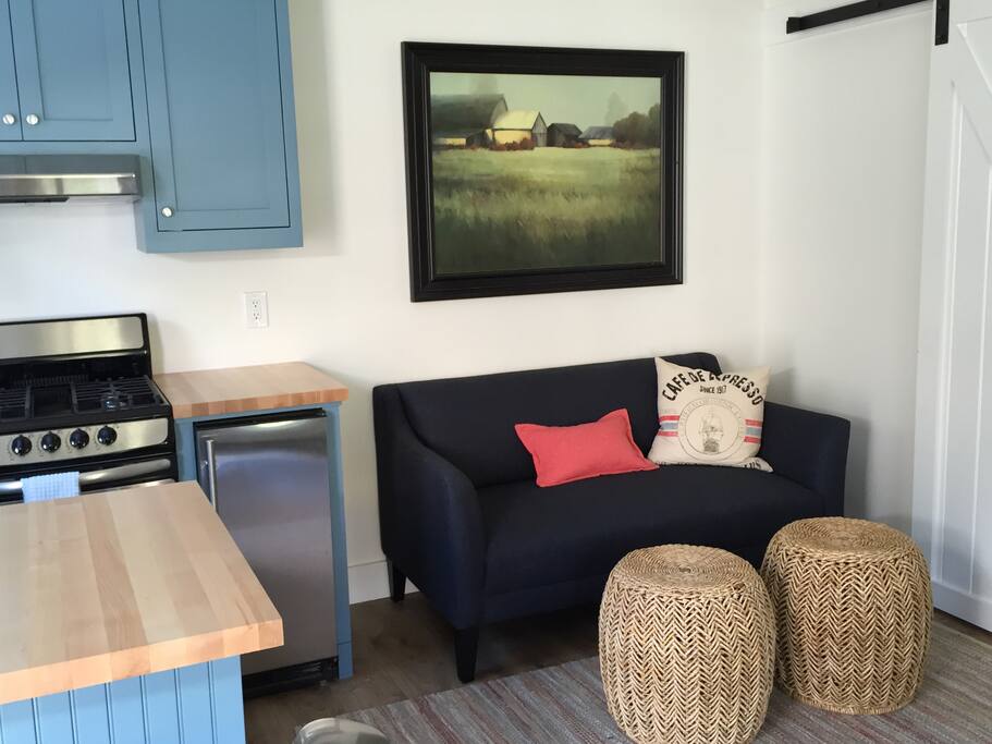 Seating area faces dresser, french doors and TV