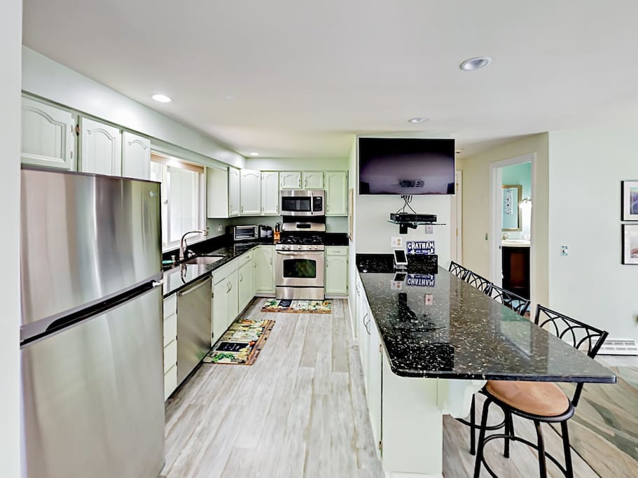 The chef of the group will appreciate the modern kitchen equipped with a flat screen TV.