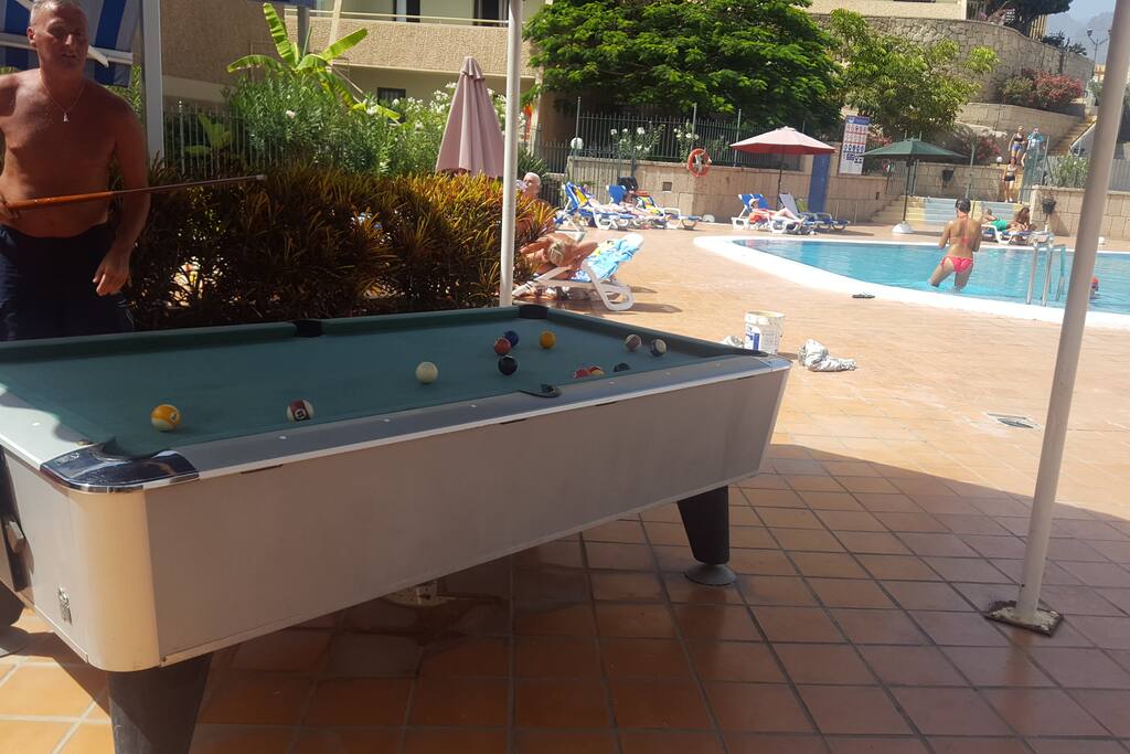 Pool table near swimming pool