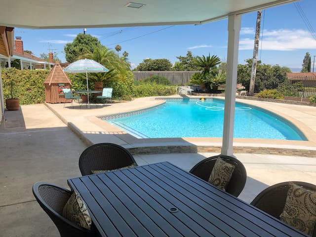 Quiet,  poolside master bedroom  with a view