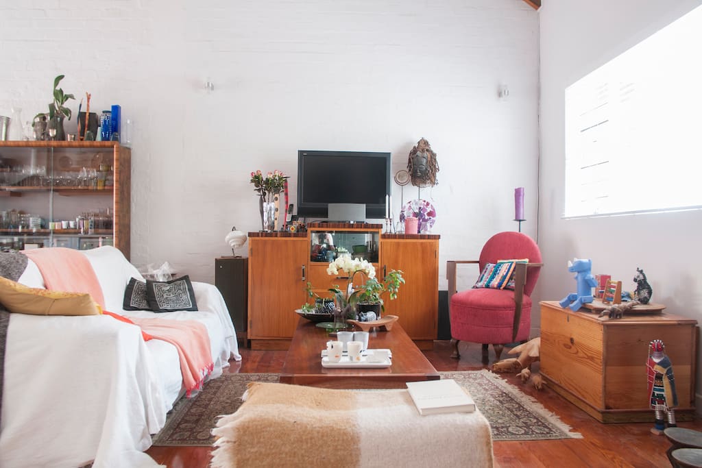 Comfortable cosy sitting room with lots of light and air and high ceilings