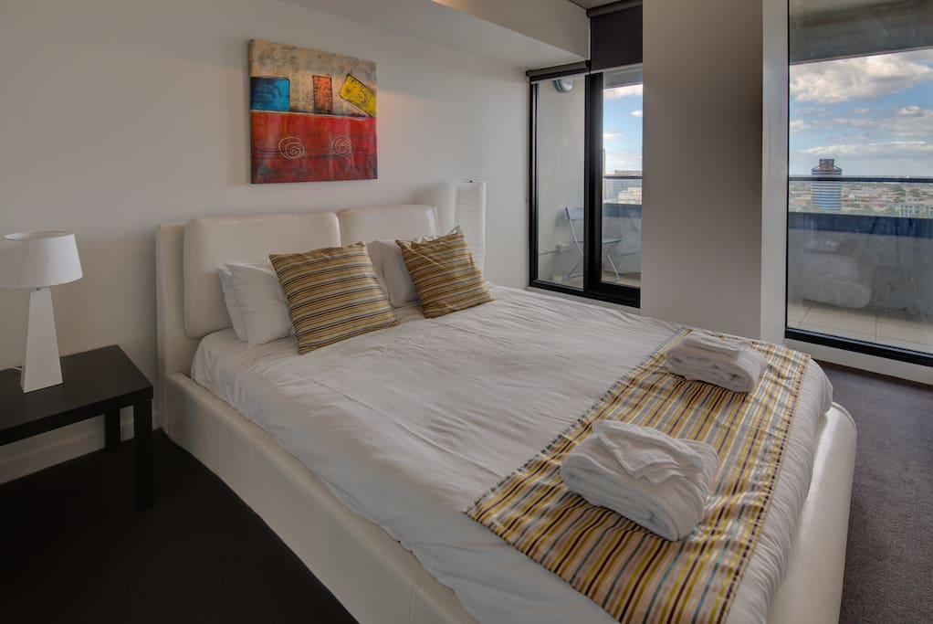 The first bedroom has a queen size bed and ensuite with views over the bay