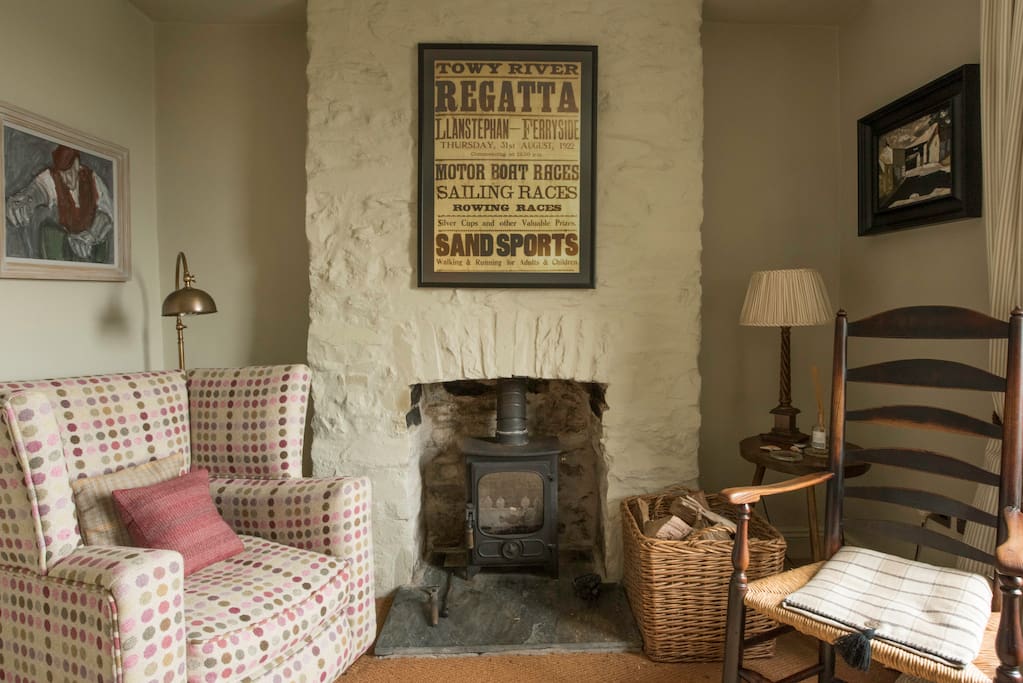 A downstairs 'cwtch' by the wood fire overlooking the garden