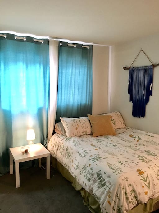 Queen size bed with large closet and desk
