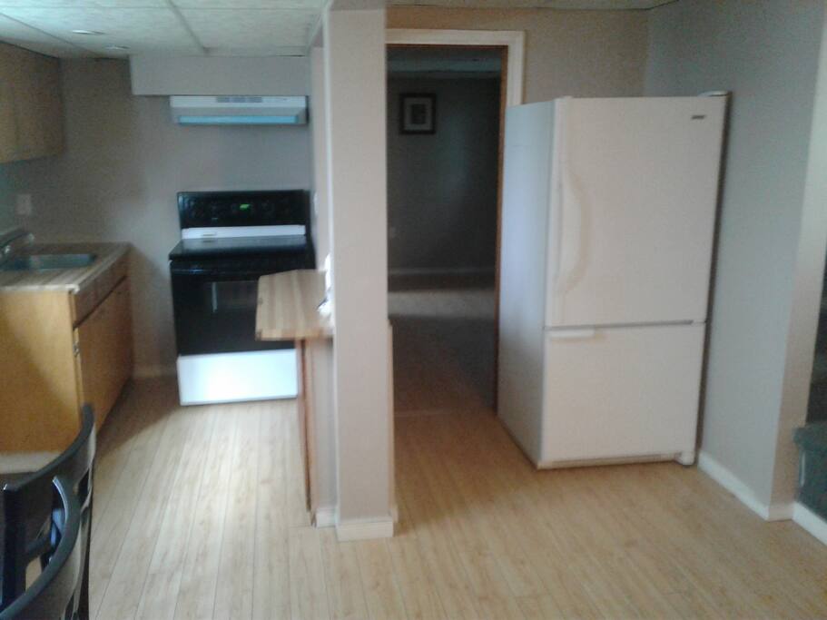 Kitchen with fridge and stove