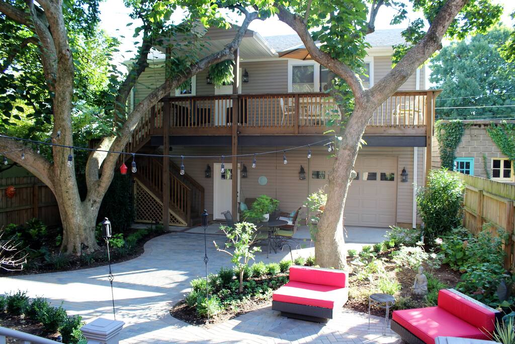 View of our Carriage House showing access stairs, deck and garage underneath