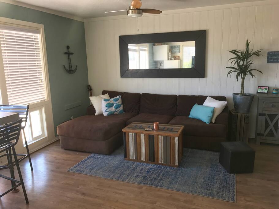 Open living room with blankets to cuddle or set up an extra bed
