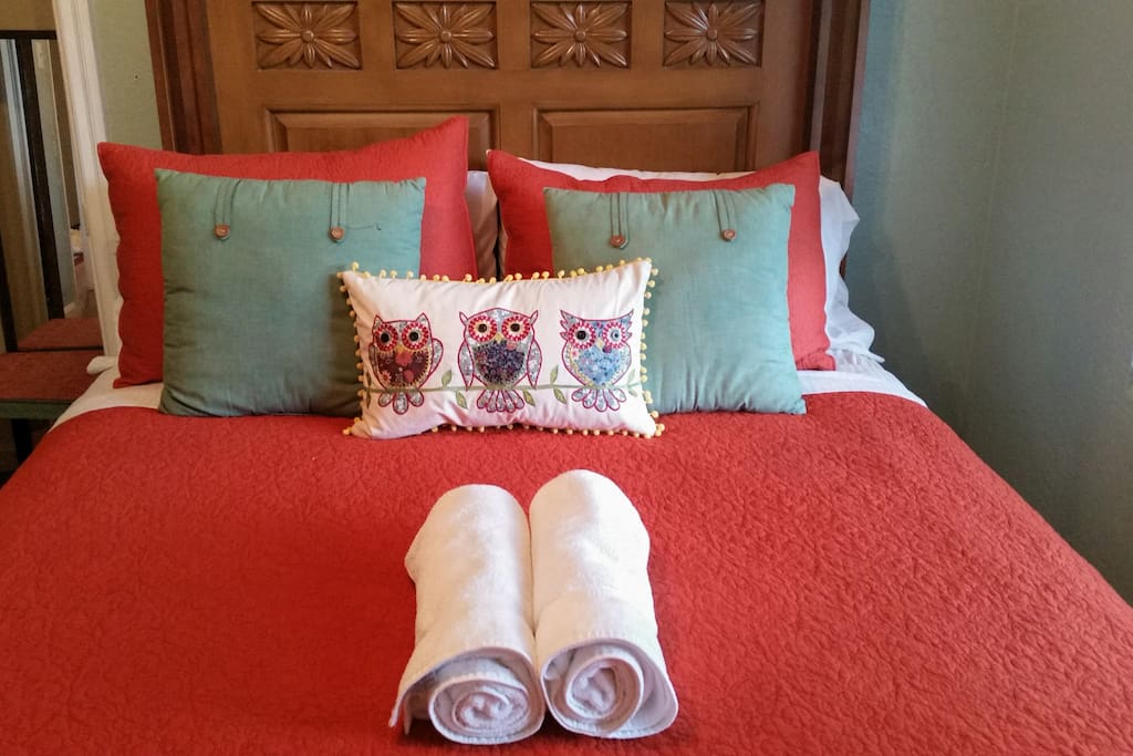 Room 2- Queen Size Pillow top bed. Very comfortable. Also lots of light from a large window with a ceiling fan and light.
