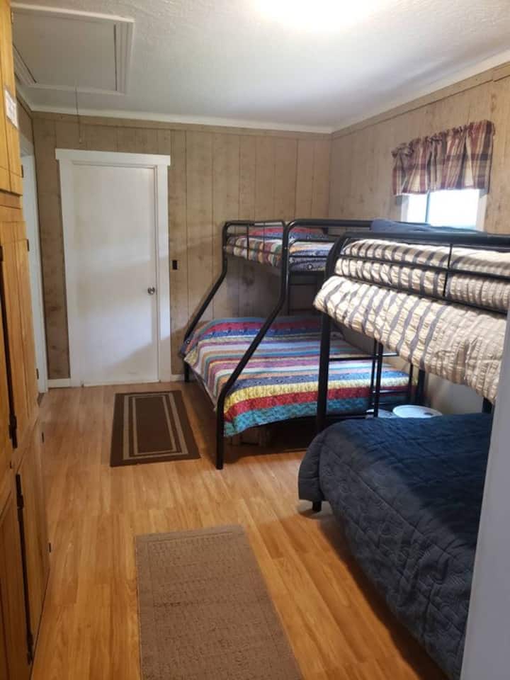 Bunk Room & door to bathroom with claw foot tub