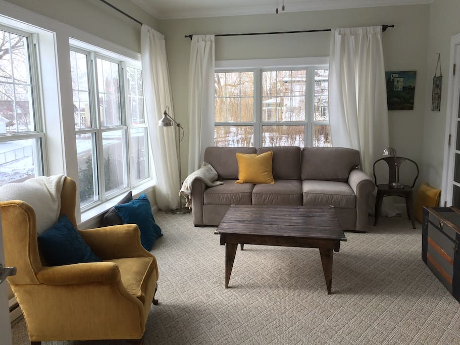 Sunroom with television and pull out couch