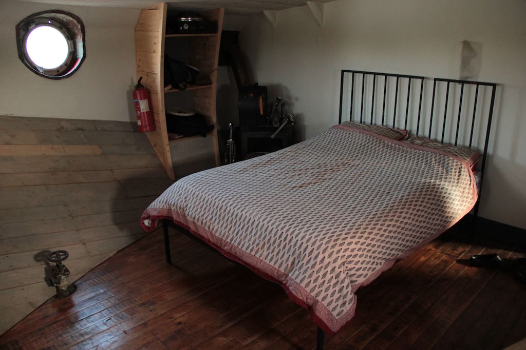 Double bed with memory foam topper.