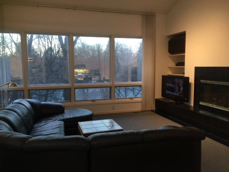 Wood fireplace in spacious family room