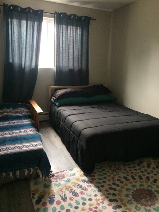 Guest bedroom featuring a double bed and single bed.
