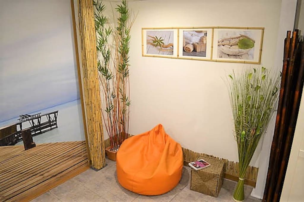 A puff for relaxing or a reading zone to read some of the books available.