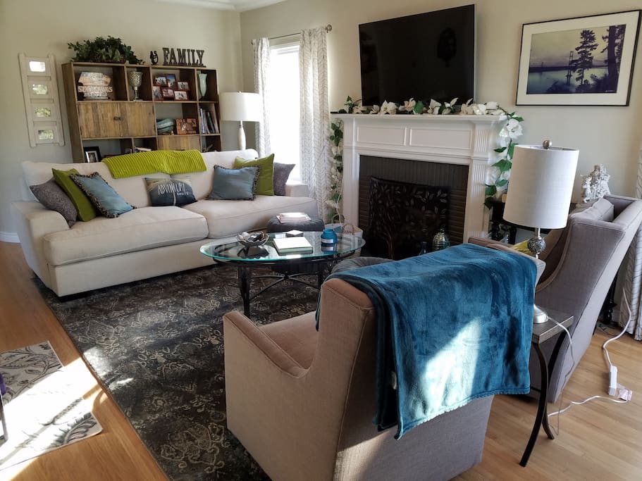 Living Room With Comfy 7' Oversized Down Sofa, Swivel Arm Chairs and 55" TV