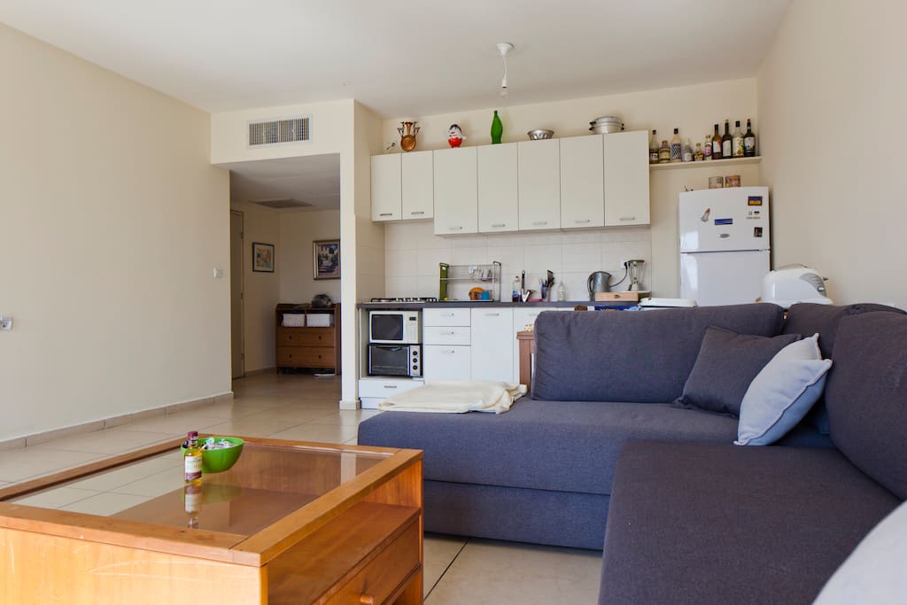 Large living room and comfortable well equipped kitchen.