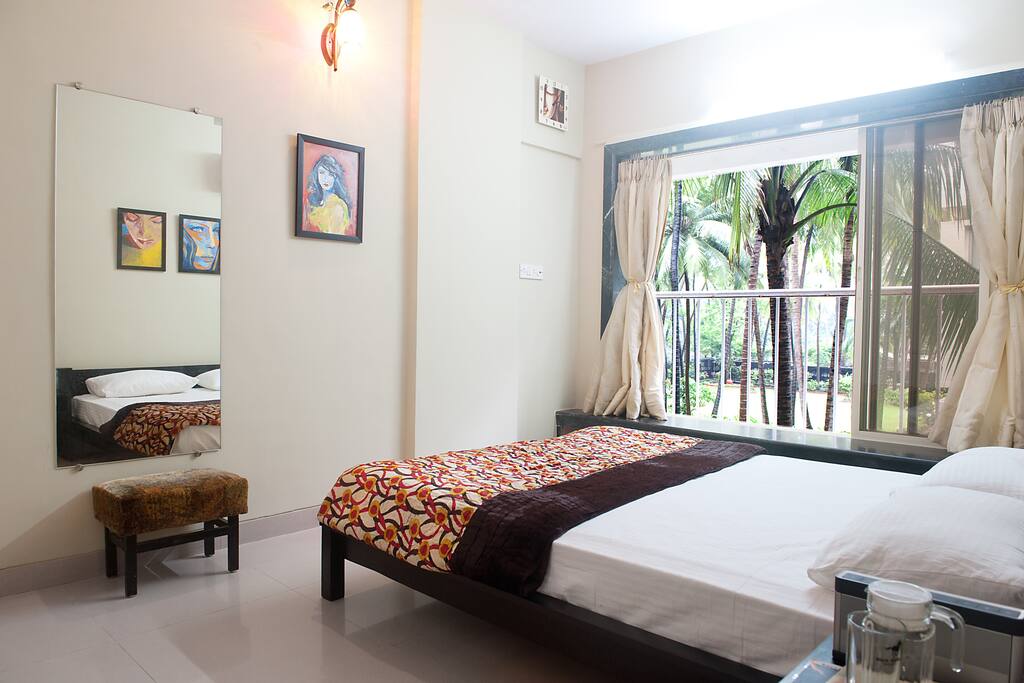 Look out of the bay window and you will see the most beautiful greens and a 100 year banyan tree ! If you are lucky, you can see the coconuts being plucked from the tall trees.