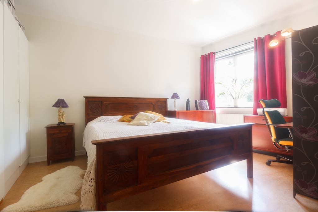 One of the bedrooms with a king size bed.