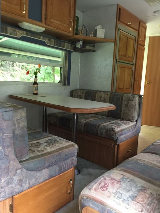 Cozy eating space that also folds to a bed. (Table removes and lays in the space.)