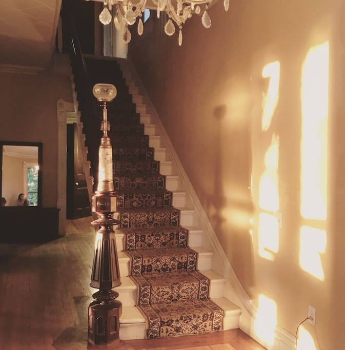 The entry hall and main stairs leading up to the bedrooms on the 2nd floor