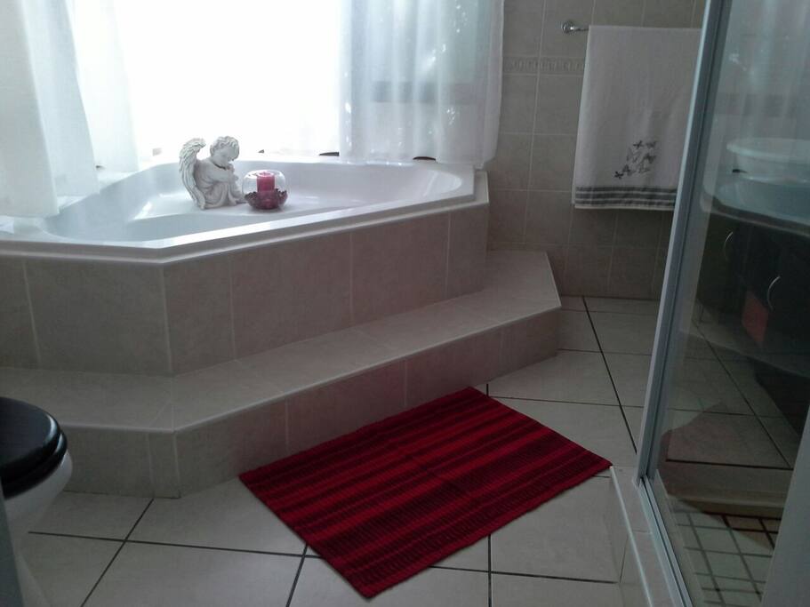 En-suite bathroom with shower and bath