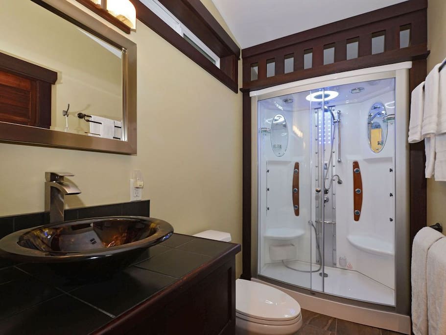 Garden Suite bathroom includes a 2-person steam shower with 12 Jacuzzi jets