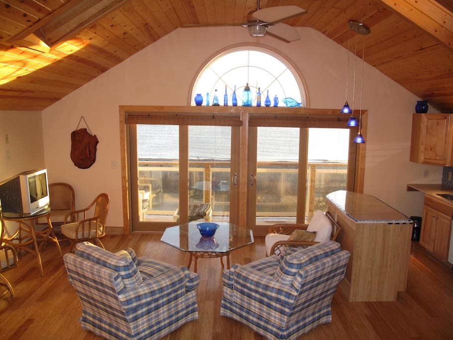 Second floor living area with vaulted ceiling, bamboo floors