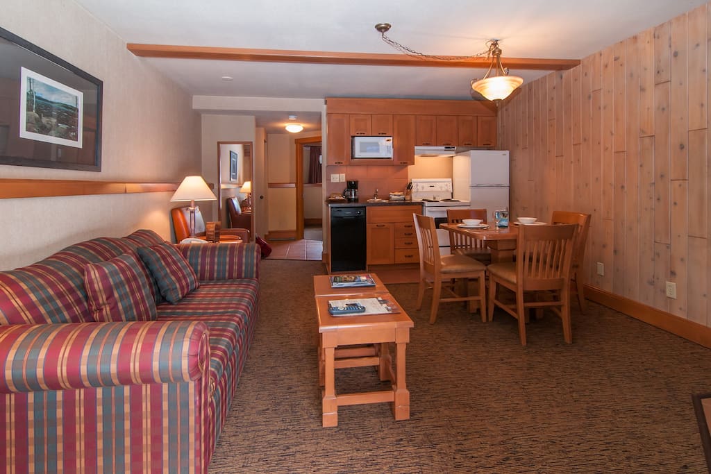 Our cozy mountain condo features warm and inviting living spaces.