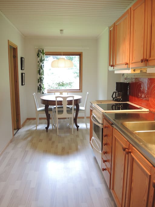 Kitchen with room for 4 people around the dining table.