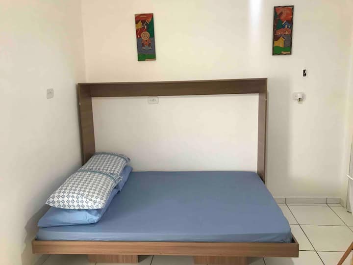 Room with air conditioning, TV, DVD, minibar, double bed and air circulator.