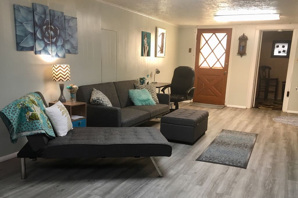 Living space furniture opens flat into beds