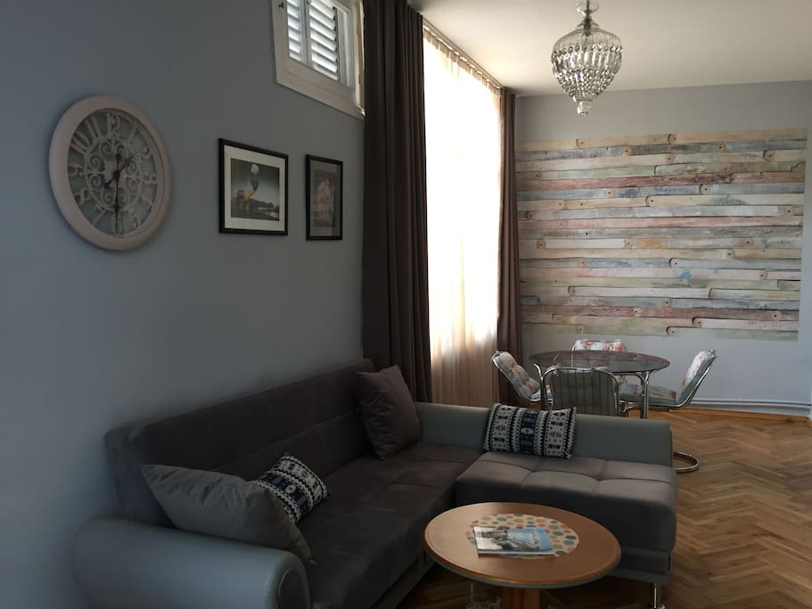 Livingroom: comfy lounging area with flat screen TV and comfortable sleeper-sofa, that converts to a queen sleeper bed.
