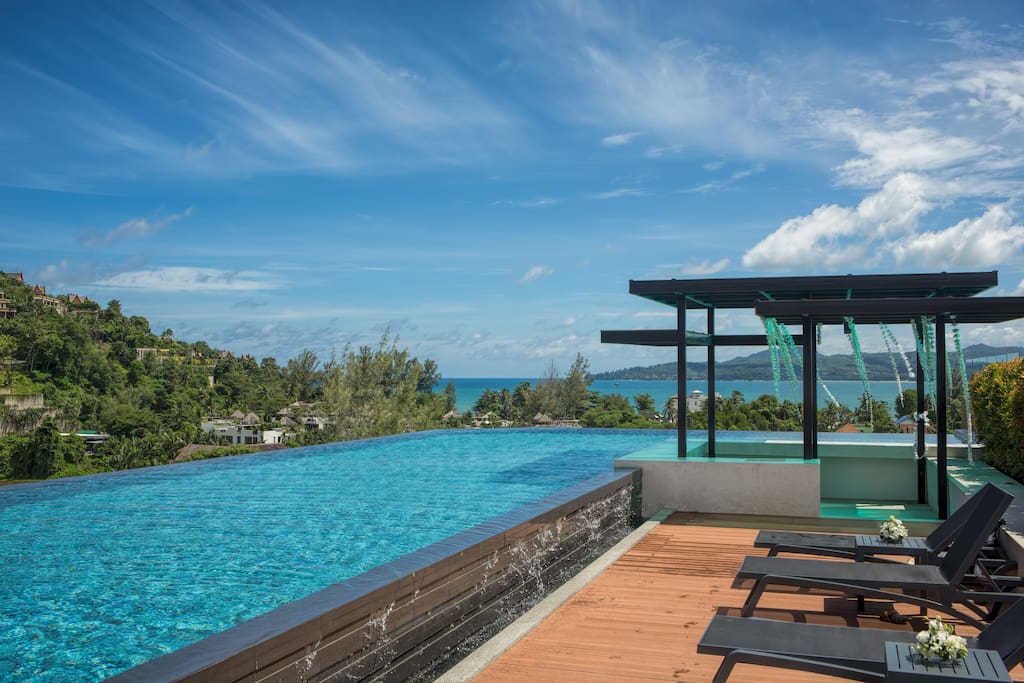 Infinity swimming pool on the roof top with the stunning mountain & sea views