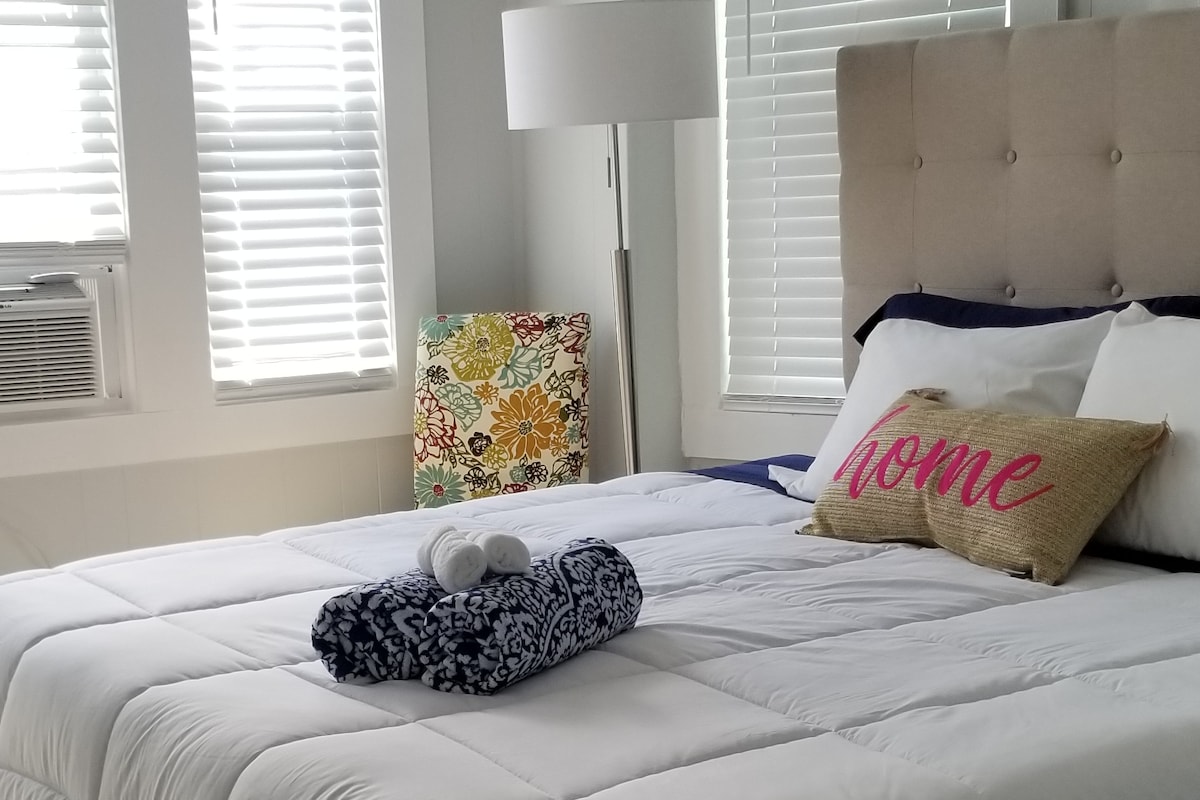 First Bedroom featuring King Sized Bed & Large Smart TV