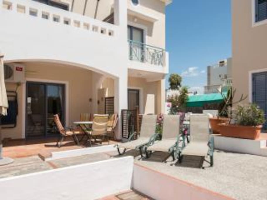 Terrace: Fully covered private terrace overlooking large communal pool