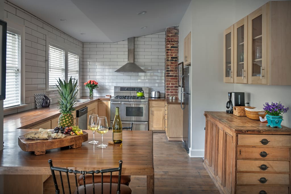 New kitchen with Eating Area and stocked Coffee Bar.