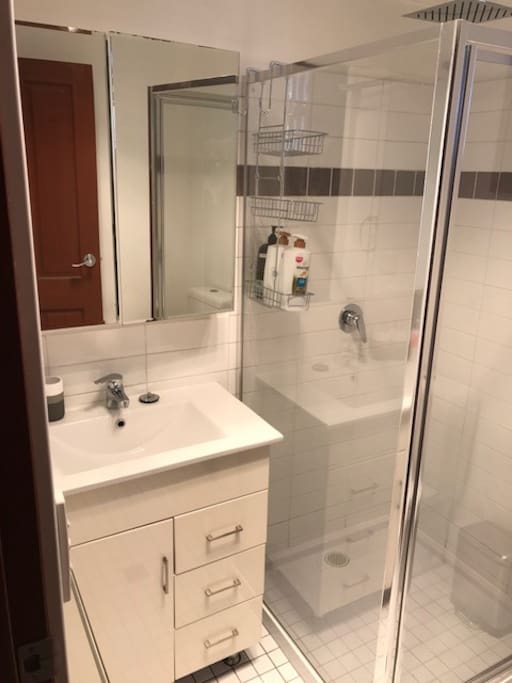 Beautiful clean & modern bathroom with hair dryer