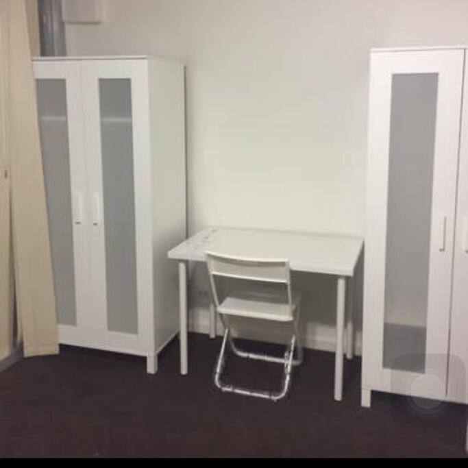 Desk and wardrobe provided